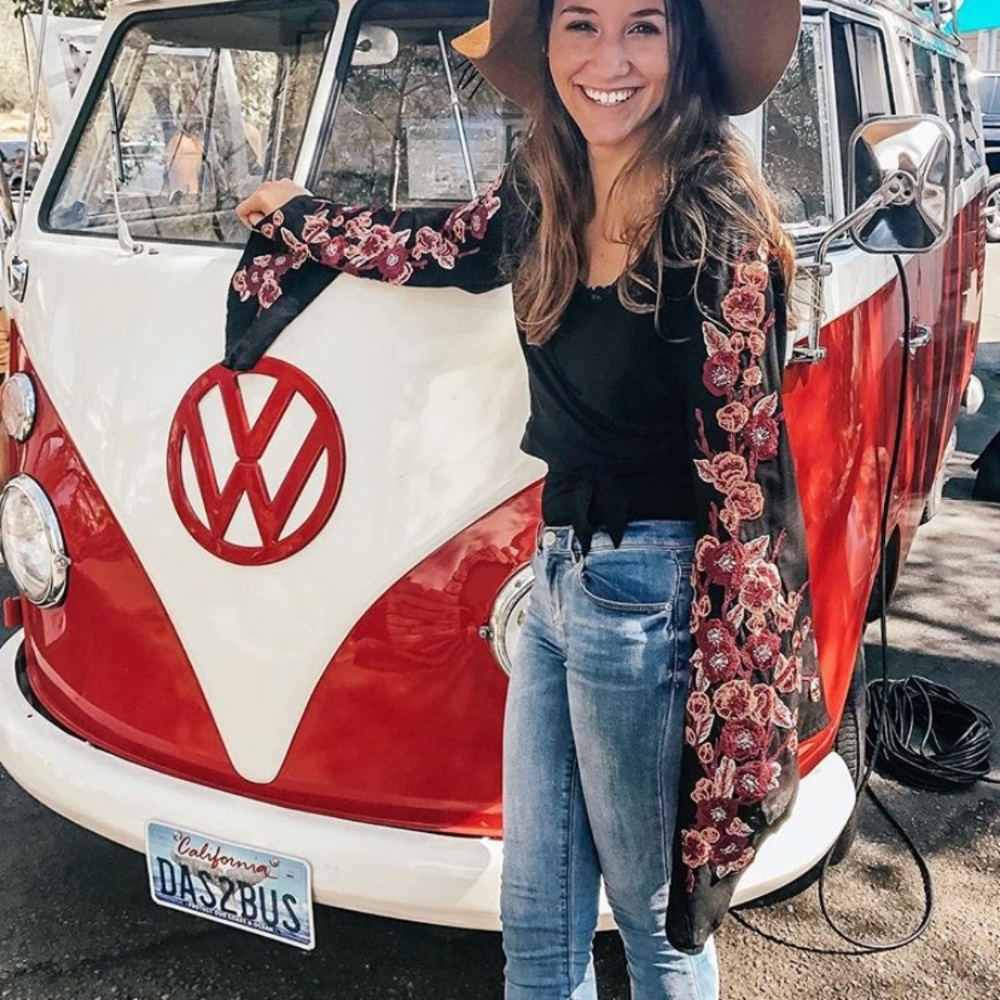 Black wrap top with embroidered flowers